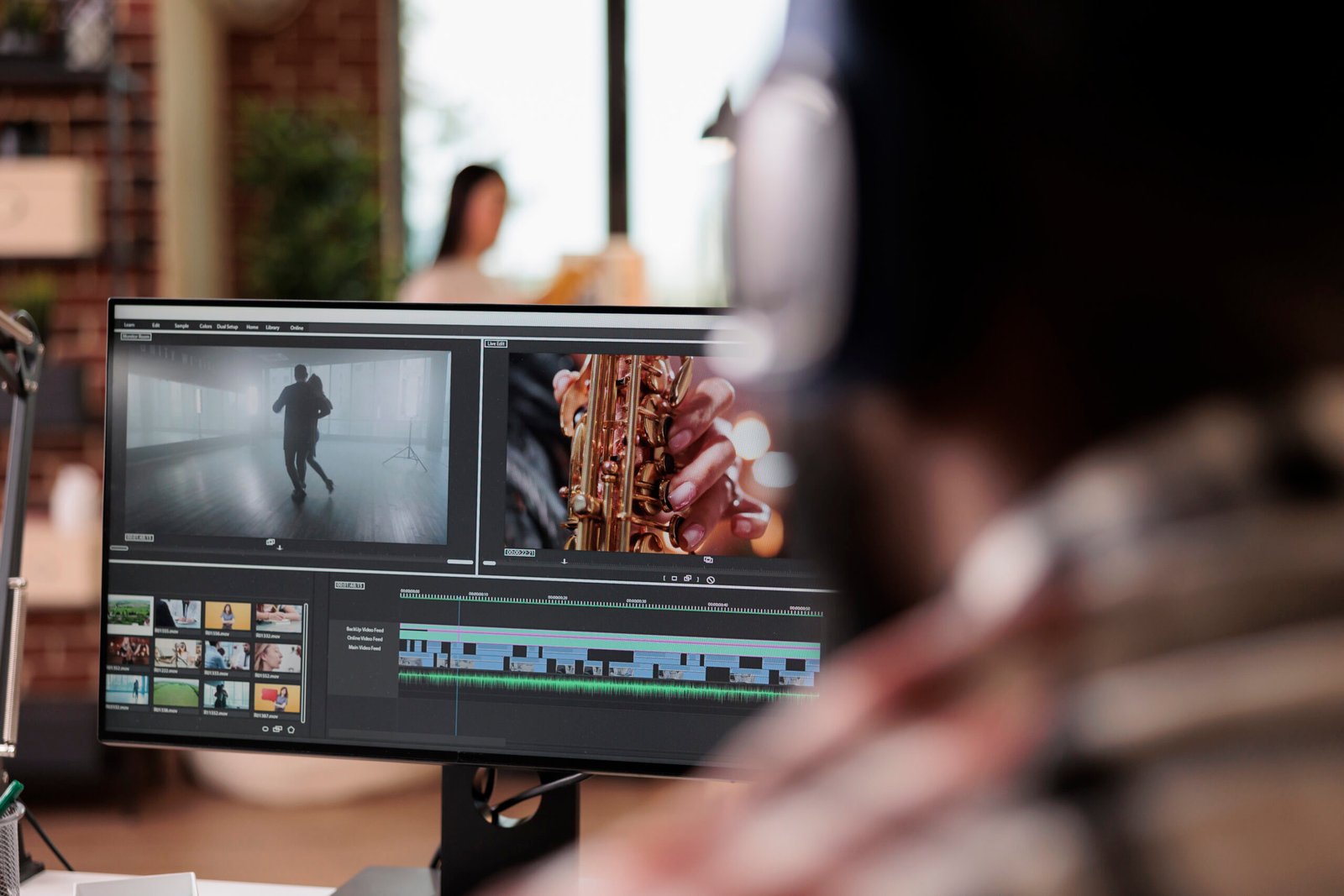 Young freelancer editing footage on software